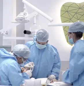 Dr Arun Chamria treating patient | Modern Dental Clinics